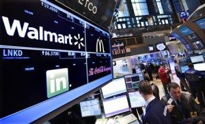 File of a board shows stock prices for Wal-Mart at the booth they are traded on the floor of the New York Stock Exchange in New York